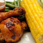 Savor BBQ Chicken Drumsticks Paired with Roasted Corn Delight